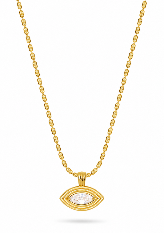 A gold chain necklace with a small oval pendant featuring a clear central stone, displayed against a plain white background.