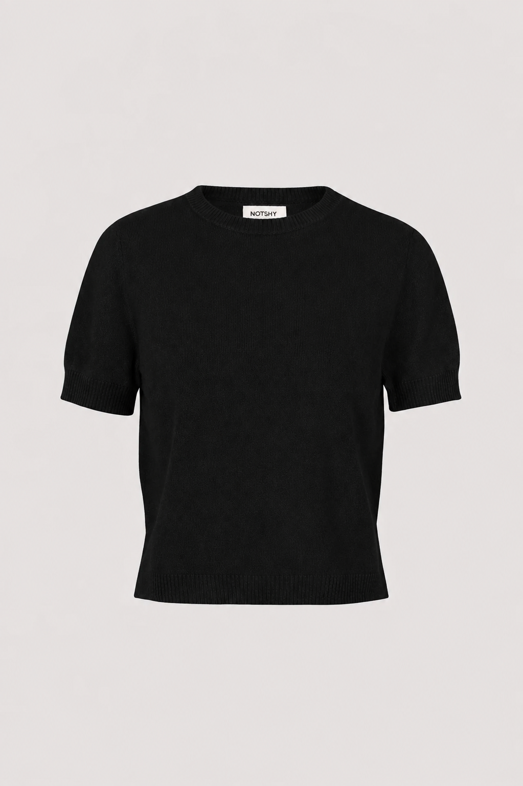 A black short-sleeve knit sweater with a crew neck, displayed flat against a light gray background. A small white brand label reading 'Maison Margiela' is visible inside the collar.