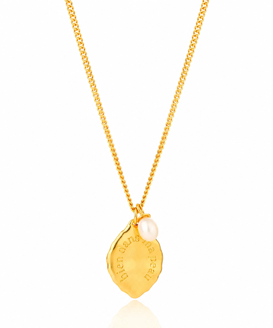 Gold necklace with a pendant on a white background