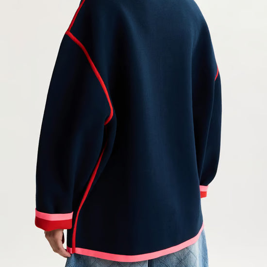 rear shot of model wearing a navy jumper