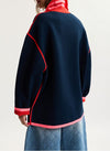 rear shot of model wearing a navy jumper