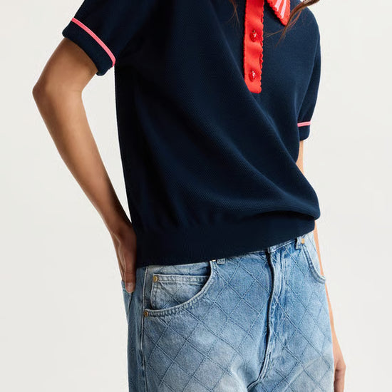 model wearing colouful polo top