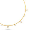 A delicate yellow gold necklace featuring small oval-cut stones along the chain and several larger clear rectangular gemstones, displayed on a clean white background.