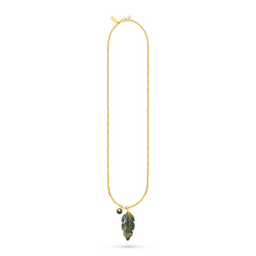 A delicate gold chain necklace featuring a small gold bead charm and a leaf-shaped pendant with green and gold detailing, displayed on a clean white background.