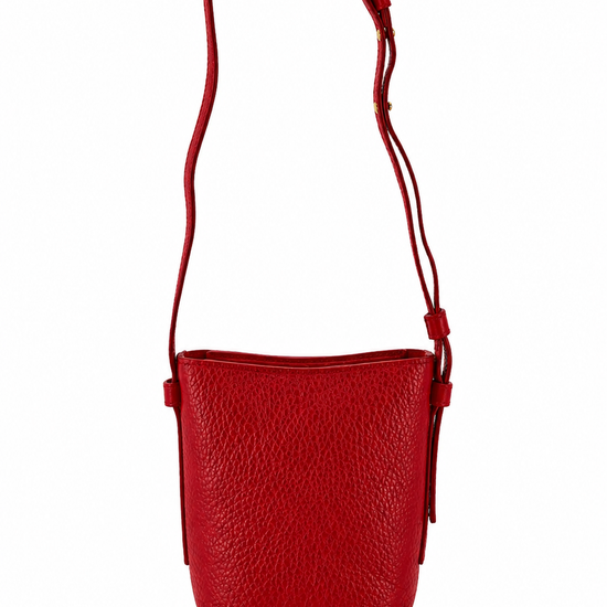 A vibrant red pebbled leather crossbody bag with a matching adjustable shoulder strap, shown against a plain white background.