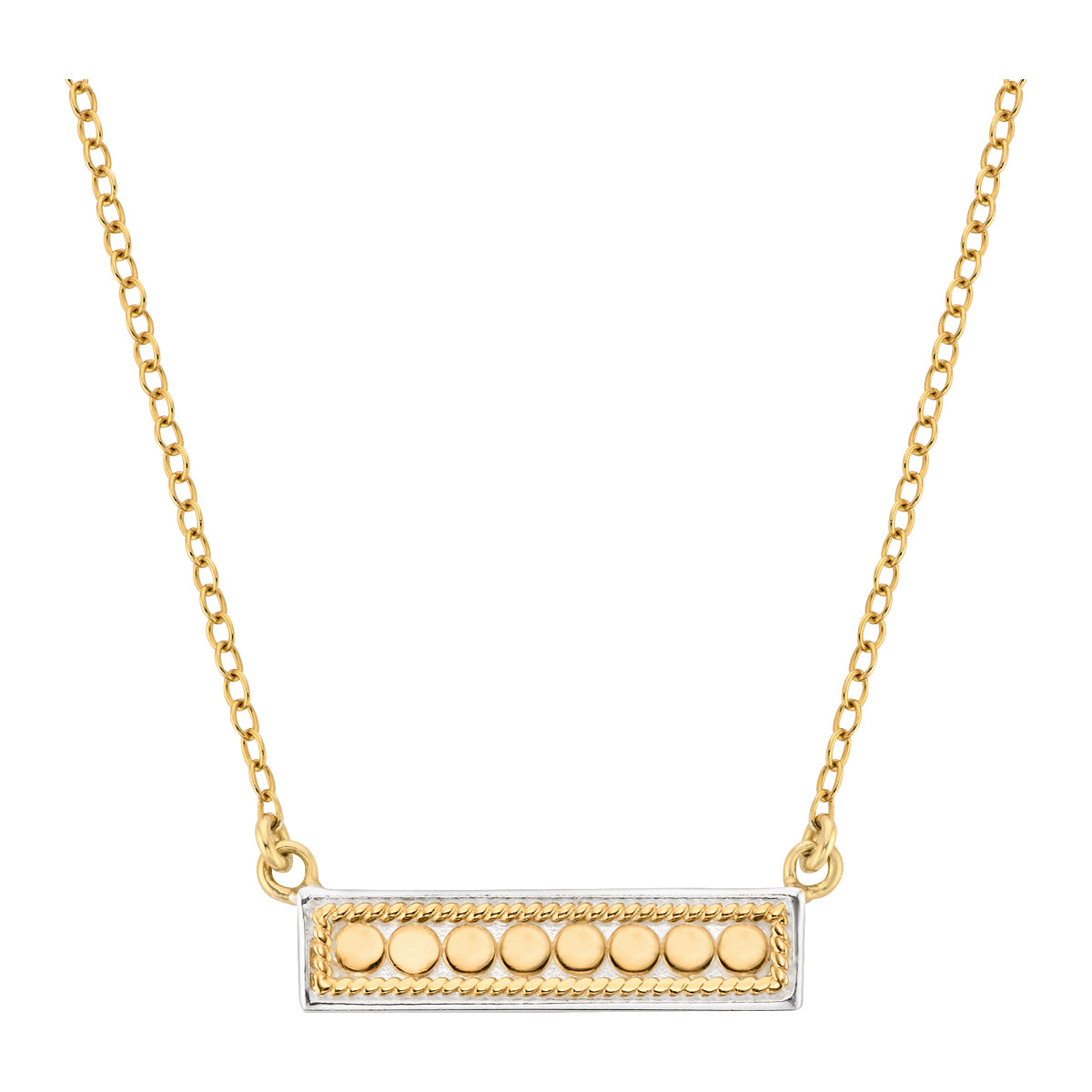Gold necklace with a rectangular pendant featuring round elements on a white background