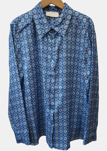 Blue patterned shirt on a hanger against a white background
