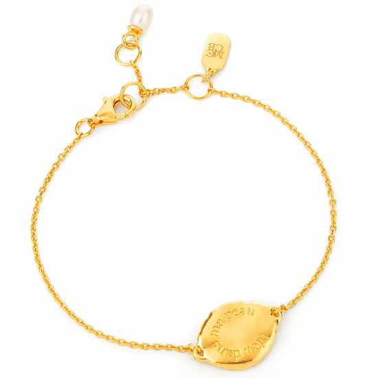 gold chain bracelet on a white background