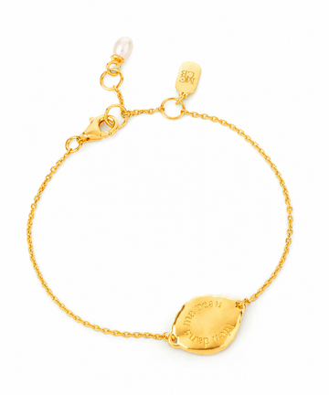 gold chain bracelet on a white background