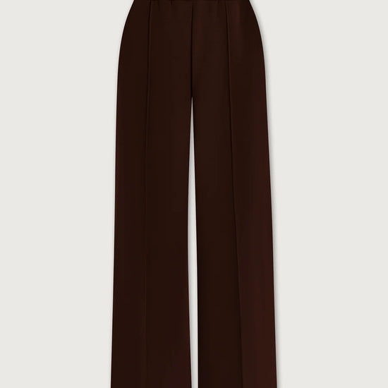Brown wide-leg pants on a light beige background