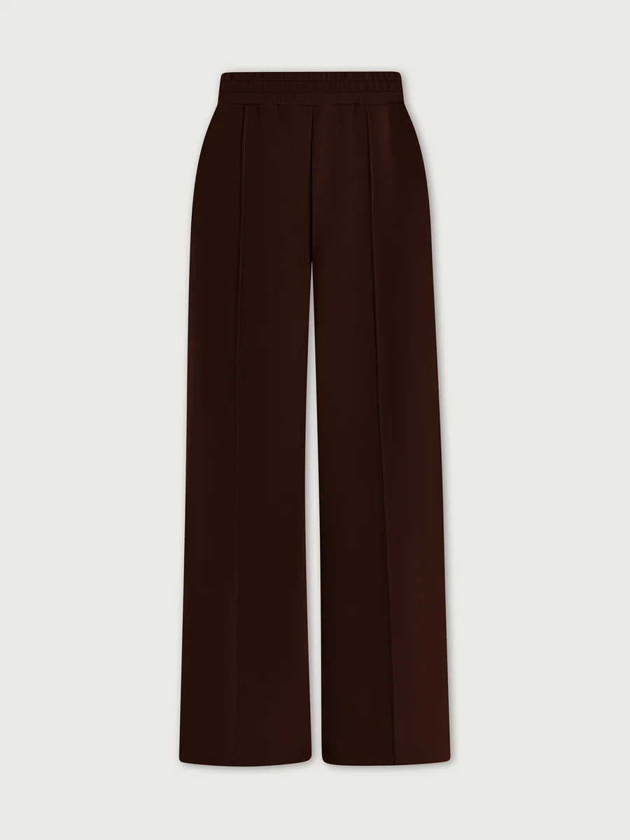 Brown wide-leg pants on a light beige background
