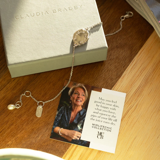 bracelet and card placed on a worktop 