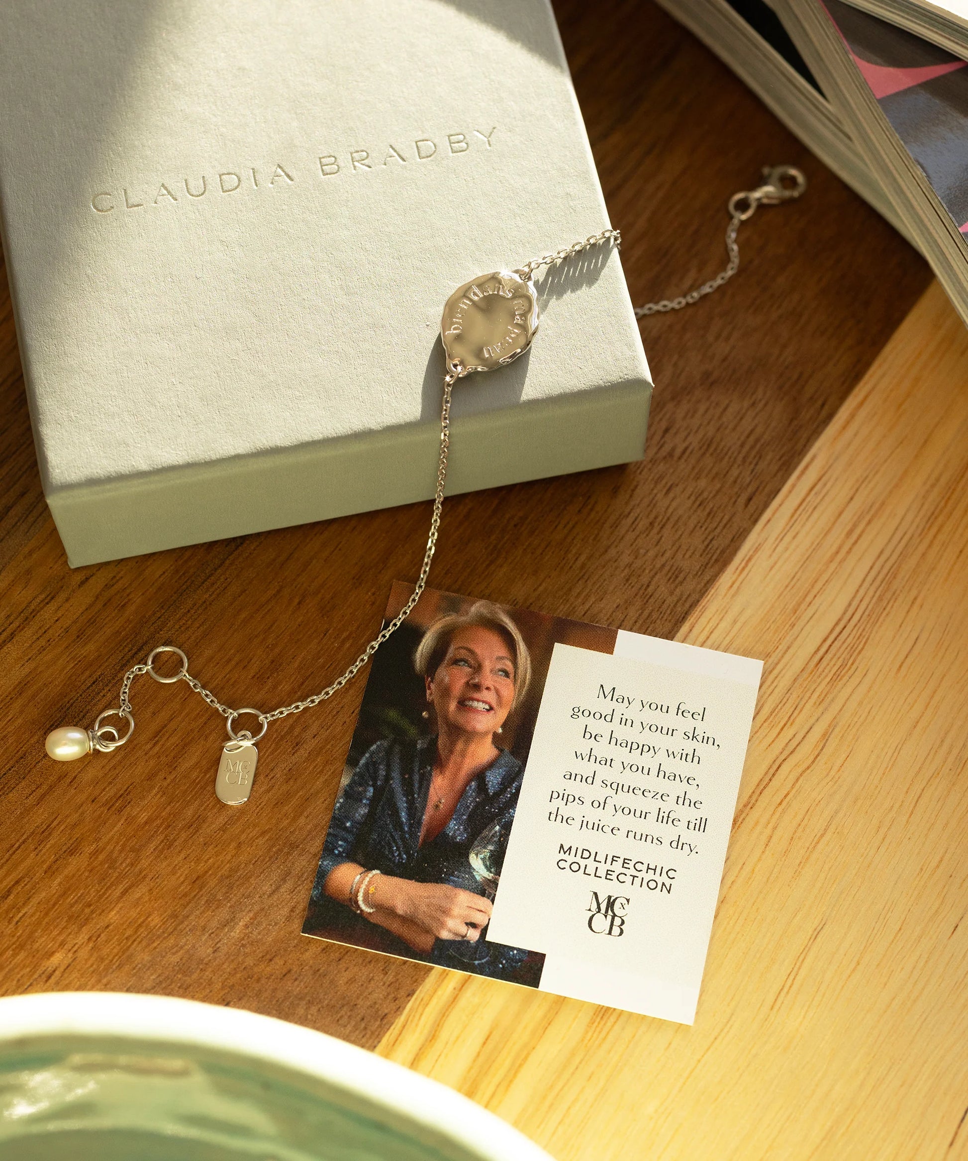 bracelet and card placed on a worktop 