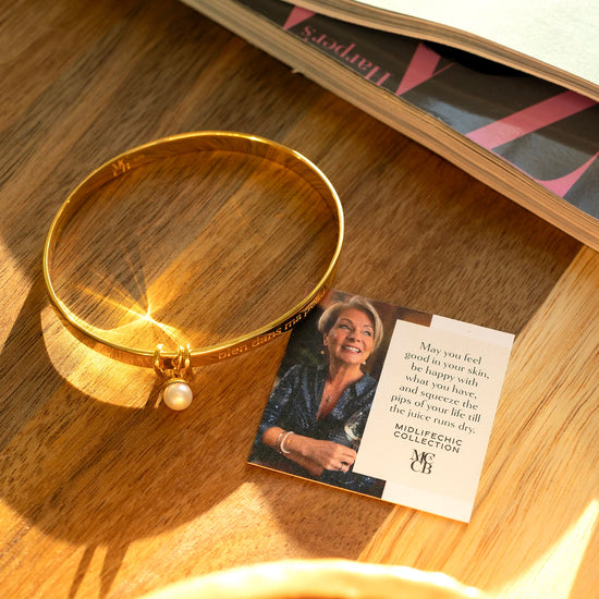 Gold bangle on a worktop