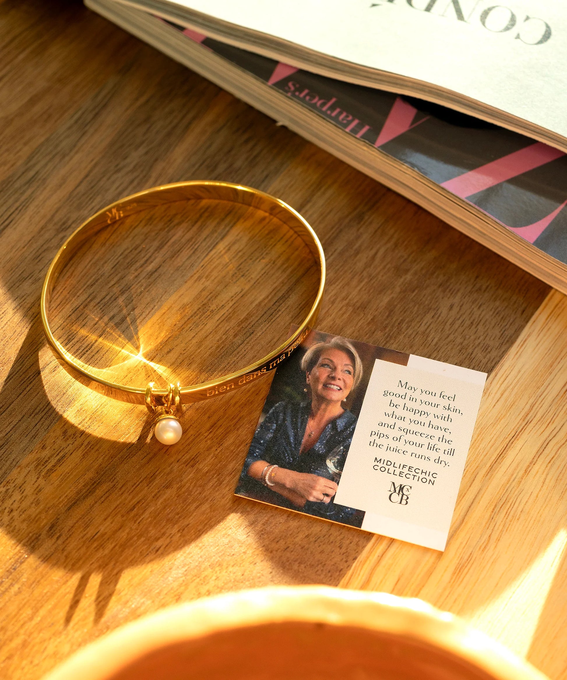 Gold bangle on a worktop