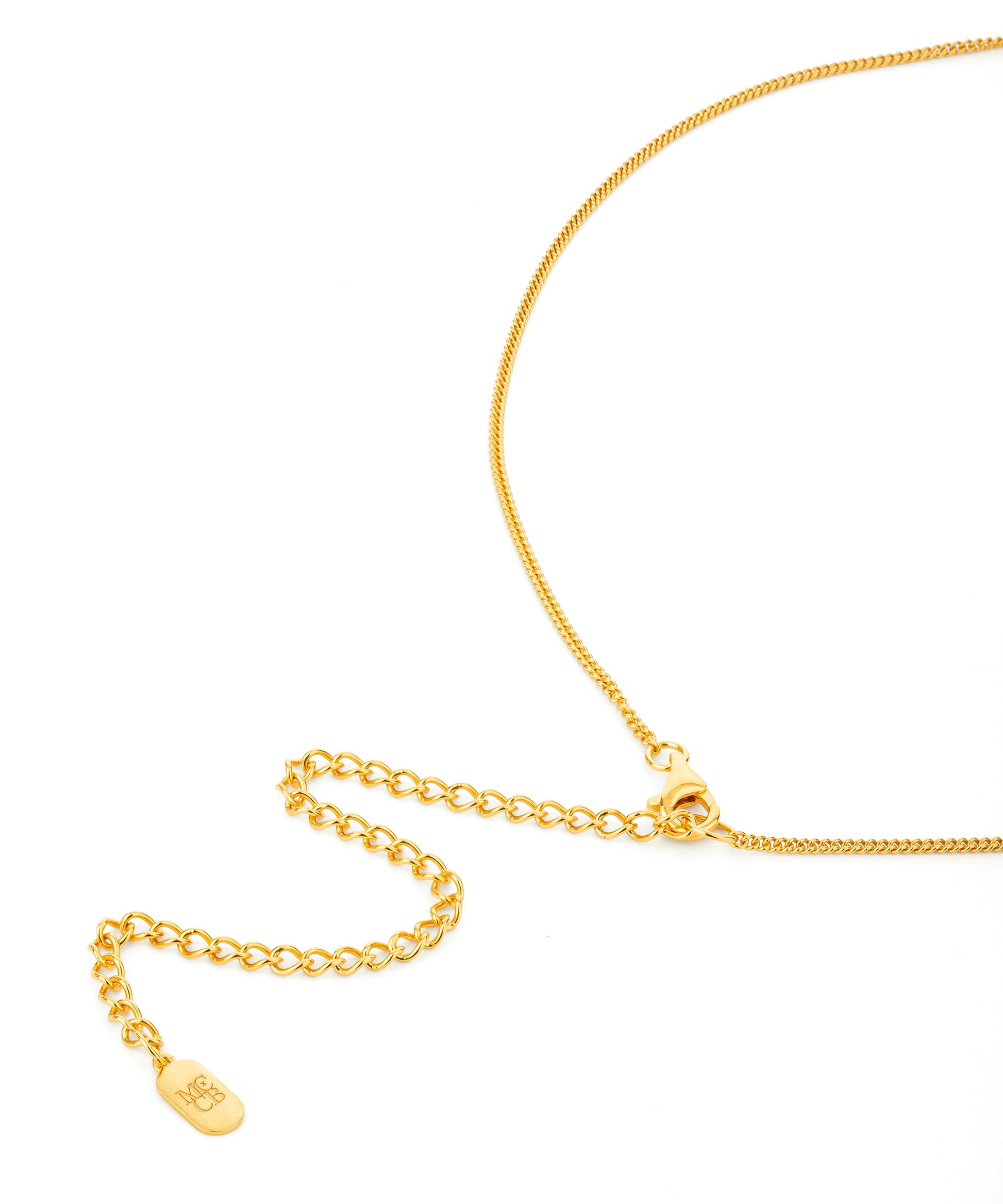 Gold chain necklace on a white background