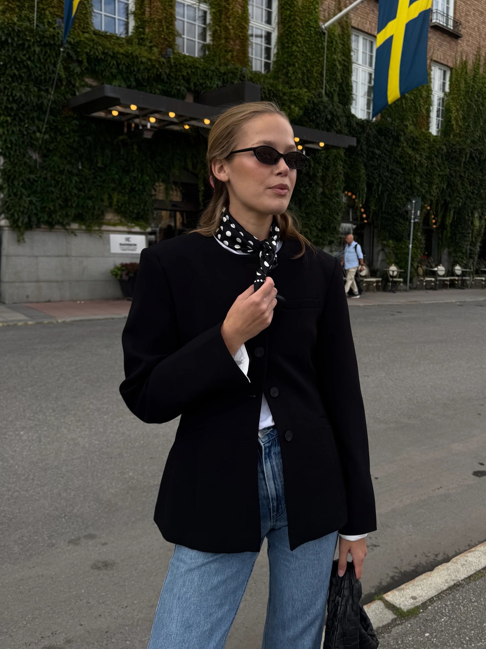 black silk square scarf with black background and white polka dots from lescarf model shot