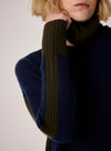 navy combination turtleneck with brown segments and rib detailing close up