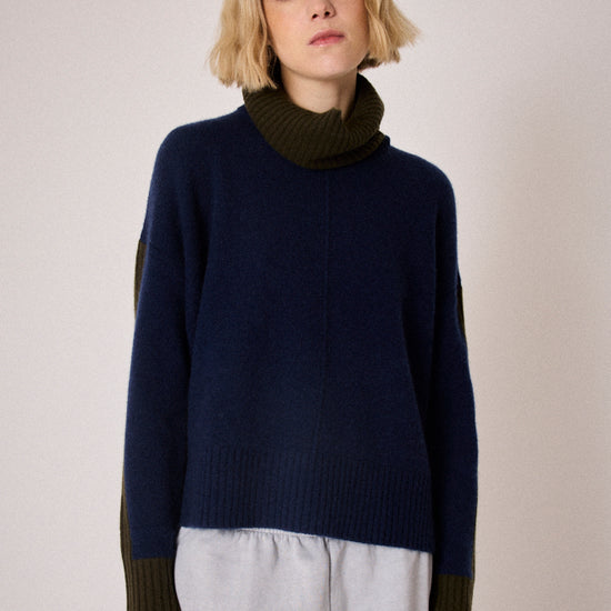 navy combination turtleneck with brown segments and rib detailing