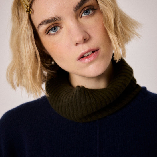 navy combination turtleneck with brown segments and rib detailing close up
