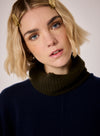 navy combination turtleneck with brown segments and rib detailing close up