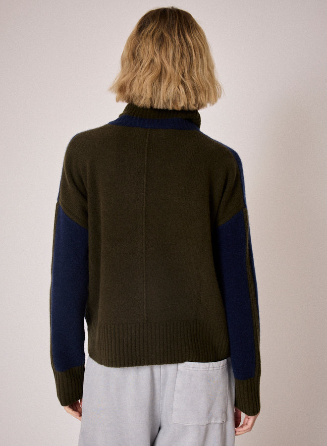navy combination turtleneck with brown segments and rib detailing rear view
