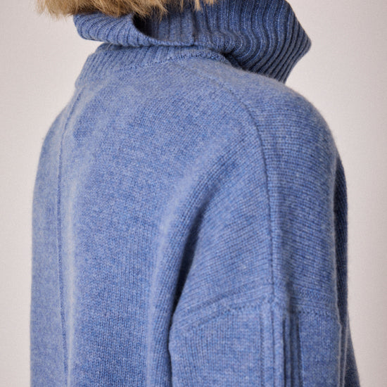 denim blue turtleneck jumper with rib and seam detailing close up