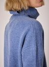 denim blue turtleneck jumper with rib and seam detailing close up