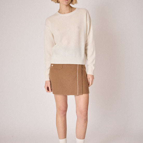cream round neck jumper with ciao on the rear in colour print model shot