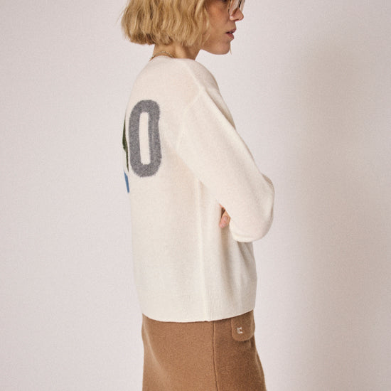 cream round neck jumper with ciao on the rear in colour print side view