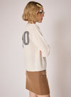 cream round neck jumper with ciao on the rear in colour print side view