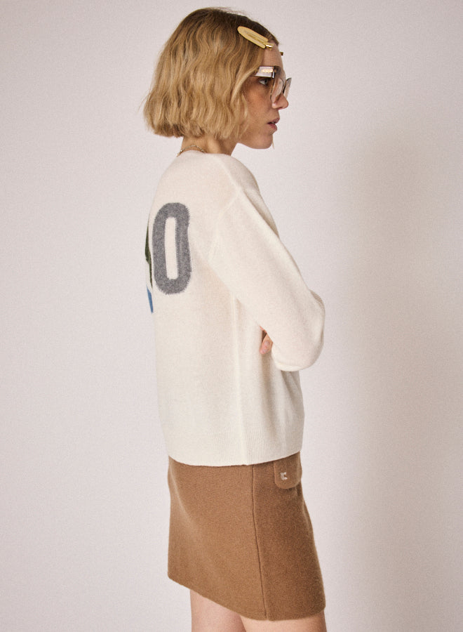cream round neck jumper with ciao on the rear in colour print side view