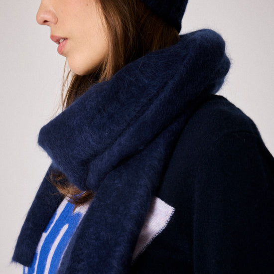 navy fluffy textured scarf close up