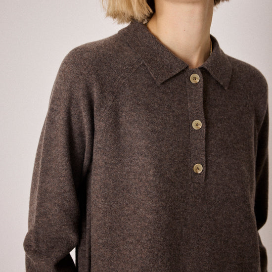 brown knit with collar, half button placket and rib detailing close up