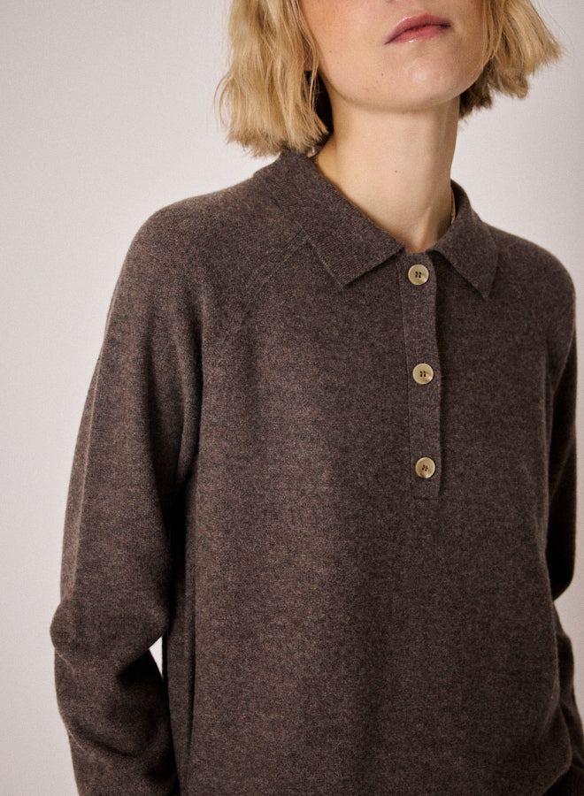 brown knit with collar, half button placket and rib detailing close up