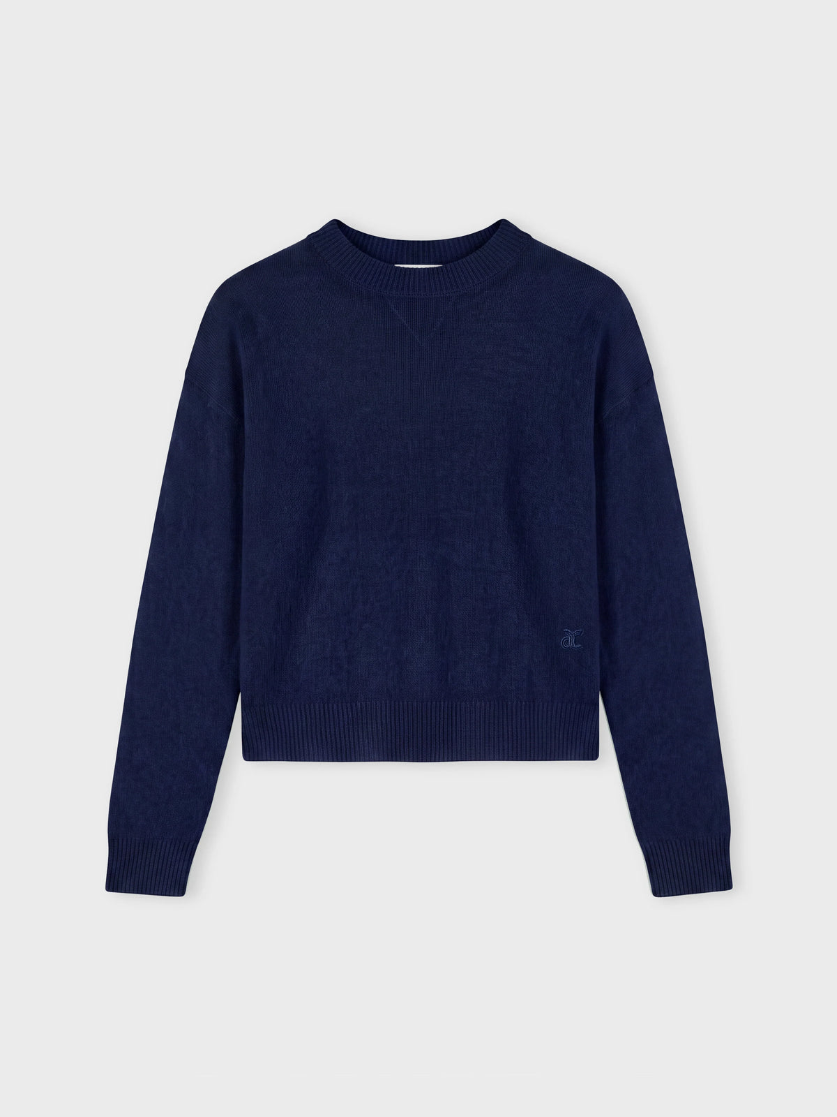 Navy blue sweater on a grey background
