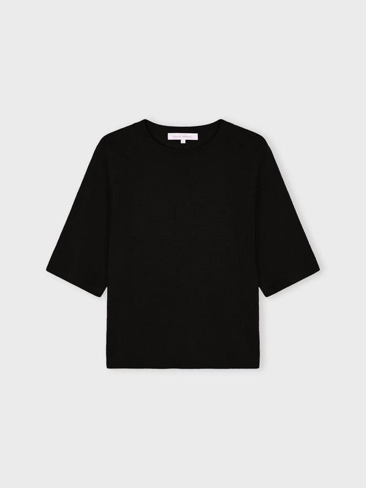 A black short-sleeve knit top with a crew neck, displayed flat against a light gray background.