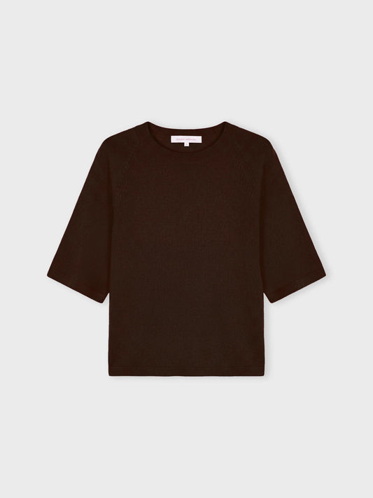 A dark brown short-sleeve knit top with a crew neck, displayed flat against a light gray background.