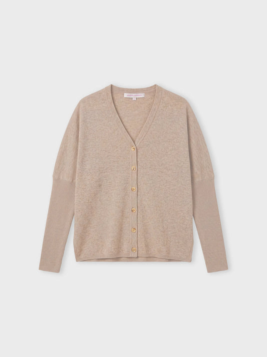 A light beige knit cardigan sweater with long sleeves and a button-up front, displayed flat against a light gray background.