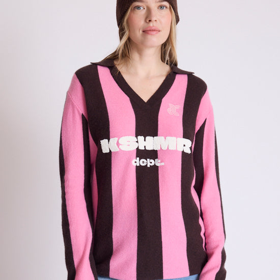 woman wearing brown beanie and stripe jumper