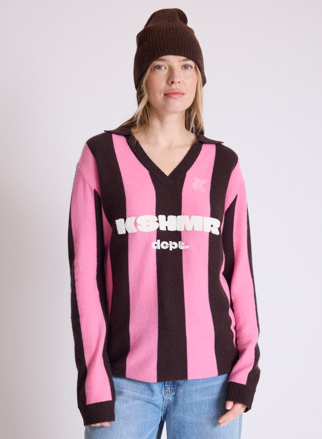 woman wearing brown beanie and stripe jumper