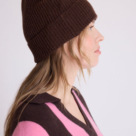 woman wearing brown beanie side view