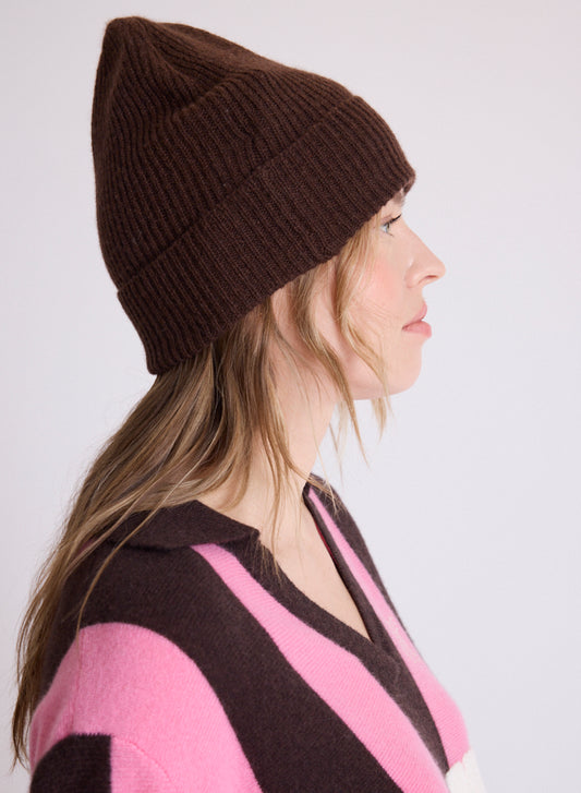 woman wearing brown beanie side view