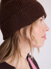 woman wearing brown beanie close up