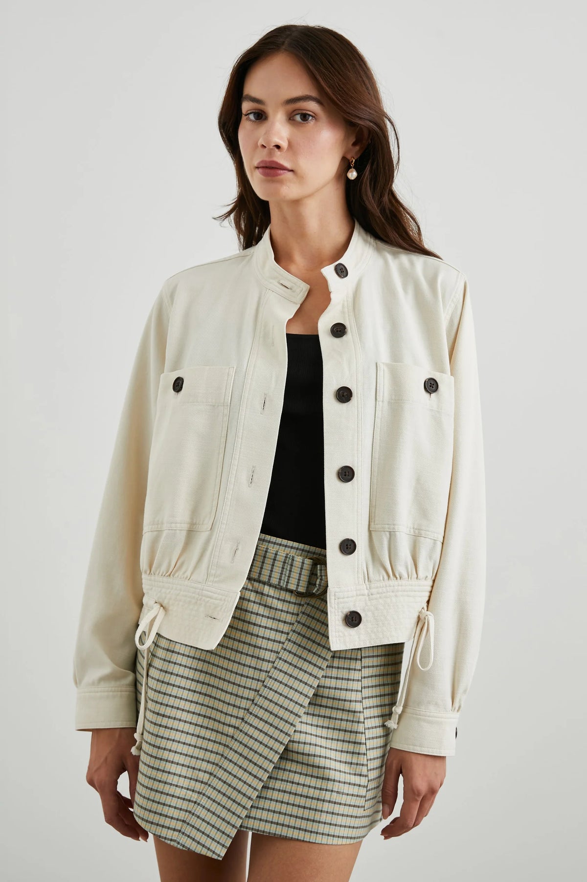 Ecru short button fastened jacket with contrast black buttons and drawstring waist