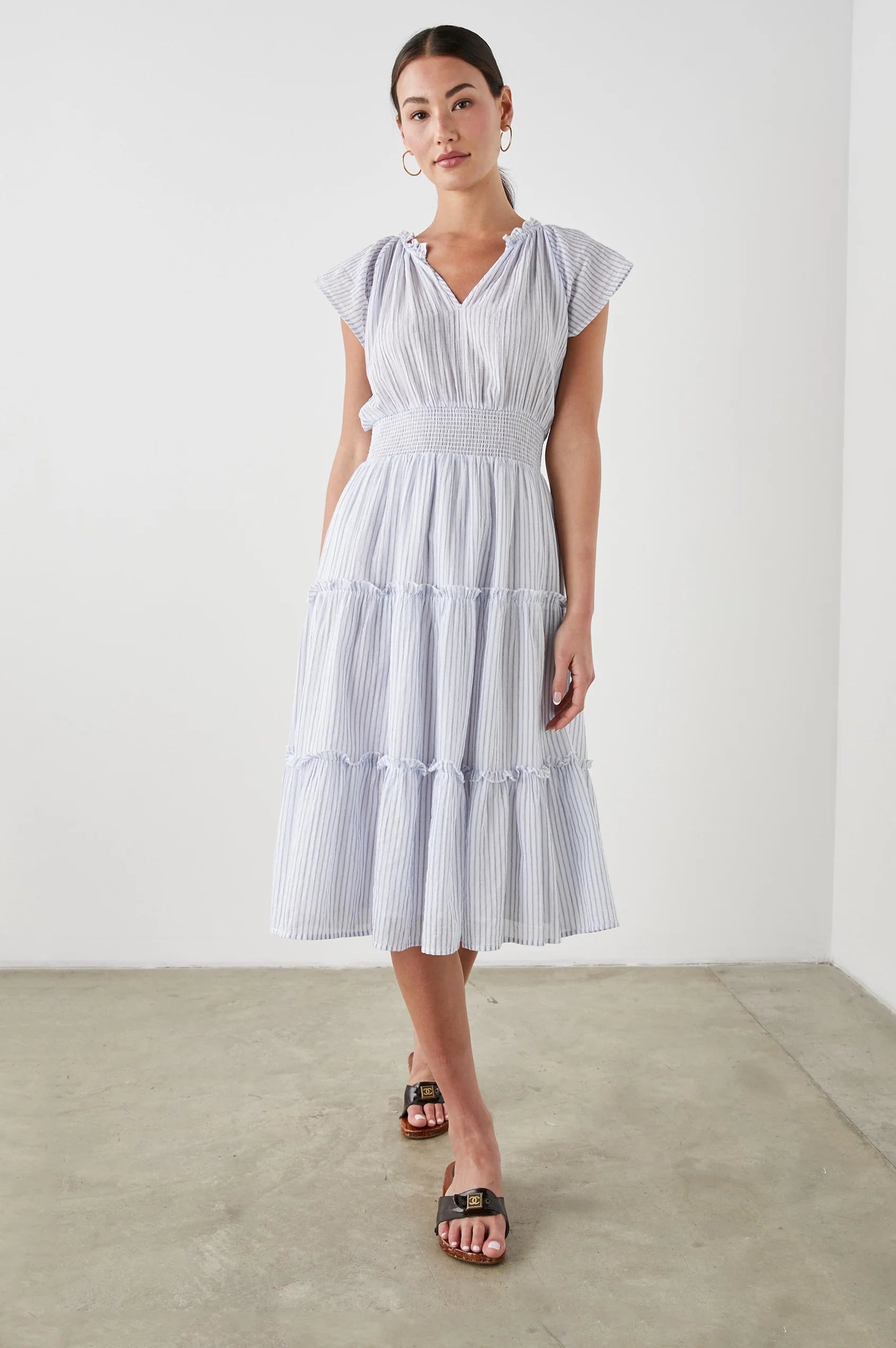 Pull on dress with short sleeves and a shirred waistband in a blue and white stripe