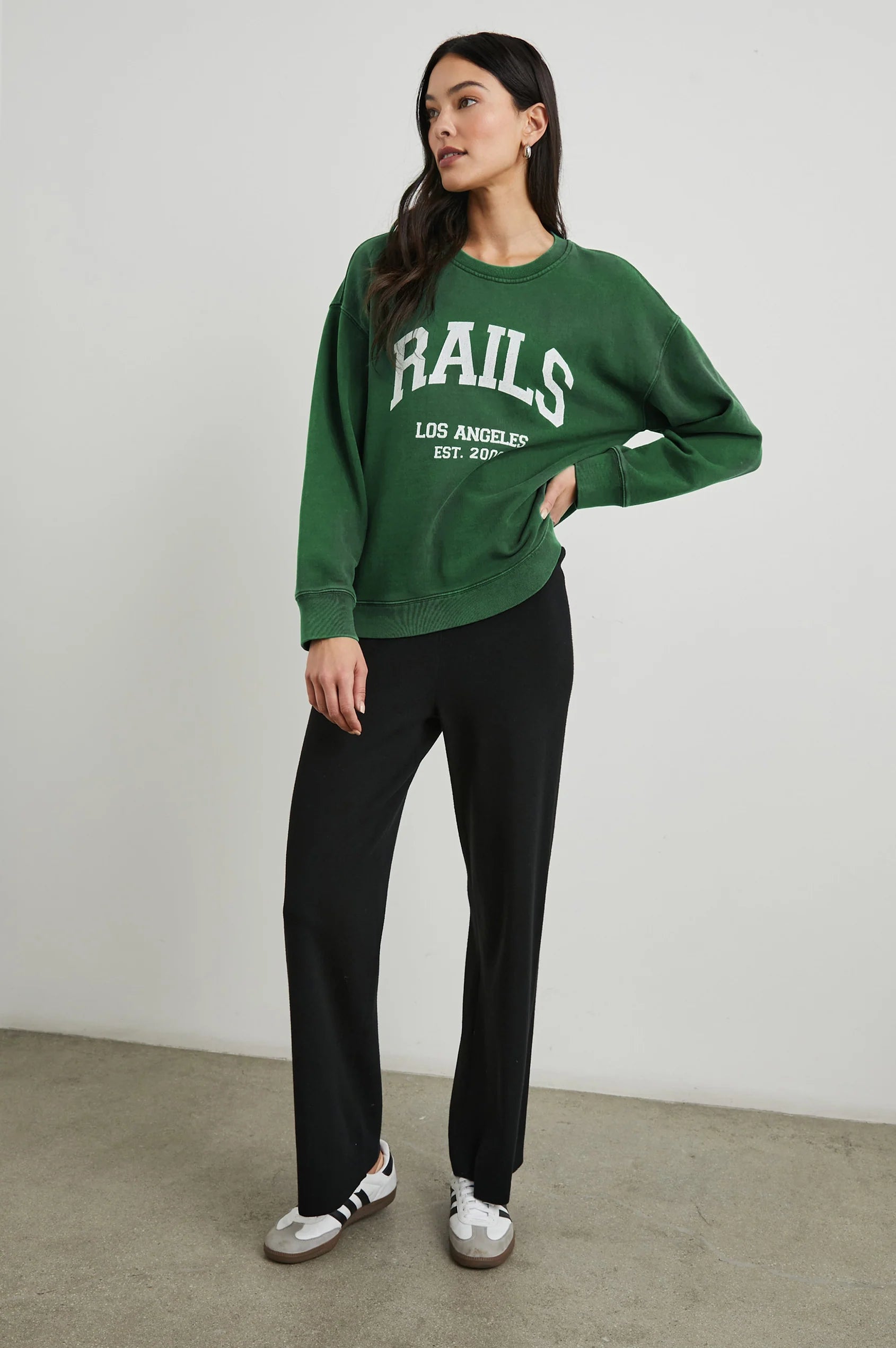 Green sweatshirt with white rails decal on the front