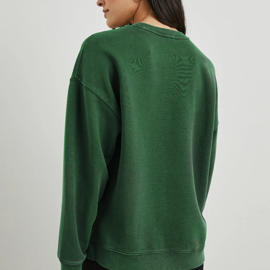 Green sweatshirt with white rails decal on the front rear view