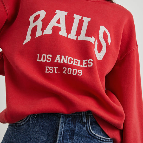 Washed red cotton swearshirt with white rails logo across the chest