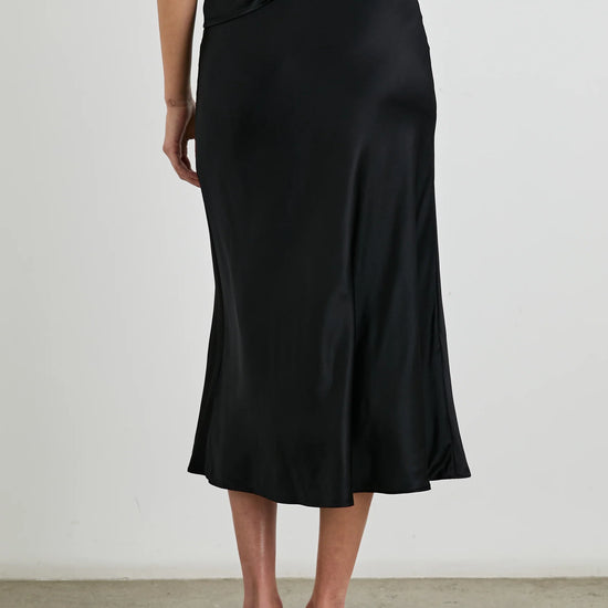 pull on bias cut satin skirt in black mid length rear view